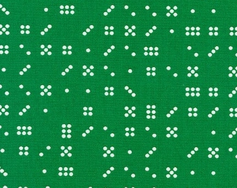 May include: A green fabric with a white geometric pattern. The pattern includes circles, squares, and lines.