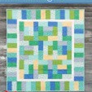 May include: A quilt pattern called "Mingle" with a patchwork design featuring blue, green, and yellow squares and rectangles. The quilt is 67 inches by 72 inches.