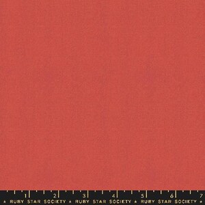 May include: A solid coral-colored fabric with a subtle texture. The bottom of the image features a black ruler with white markings and the text "RUBY STAR SOCIETY".