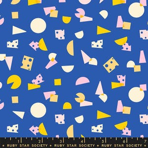 May include: A vibrant blue fabric with a repeating pattern of abstract shapes. The design includes yellow, pink, and white geometric forms, such as triangles, circles, and squares. Some shapes resemble cheese. The text "RUBY STAR SOCIETY" is at the bottom.