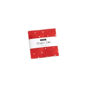 May include: Red fabric square with white polka dots. The fabric has the text "Magic Dot" printed on it.