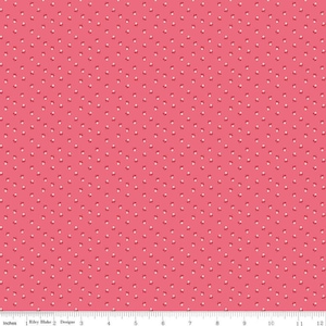 May include: A pink fabric with a white polka dot pattern. The dots are small and evenly spaced.