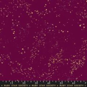 May include: A deep burgundy fabric with a scattered gold glitter pattern. The fabric has a subtle sheen and a soft texture.
