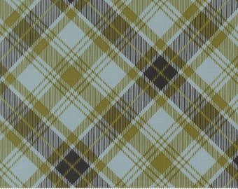 Könnte beinhalten: Ein gewebter Stoff mit einem diagonalen Karomuster in den Farben Hellblau, Olivgrün und Dunkelanthrazit. Das Textil zeigt ein sich wiederholendes Kreuzmuster mit dünnen, sich schneidenden Linien, und am unteren Rand ist ein Lineal zu sehen.
