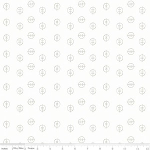 May include: White fabric with a repeating pattern of small, light gray circles and cross-like shapes. The circles contain three horizontal lines. The fabric is measured in inches.