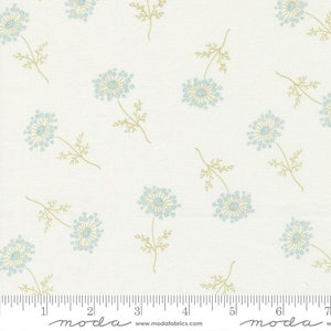 May include: White fabric with a repeating pattern of light blue stylized flowers with green stems. The fabric has a ruler with inches marked along the bottom.