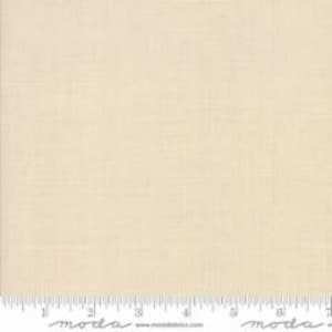 May include: A close-up of a beige fabric with a subtle texture. The fabric has a slightly off-white color and a smooth, even surface.
