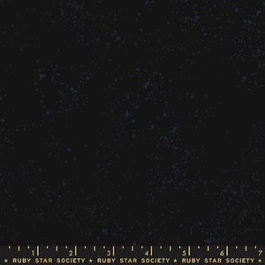 May include: Black fabric with a speckled blue pattern. The fabric has a subtle texture and a slightly distressed look. The fabric is marked with a ruler and the text "RUBY STAR SOCIETY".