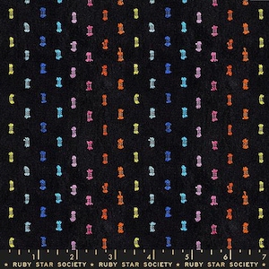 May include: Black fabric with a repeating pattern of colorful, textured, vertical shapes in blue, pink, orange, and yellow. The fabric has a subtle, woven texture. The text "RUBY STAR SOCIETY" is at the bottom.