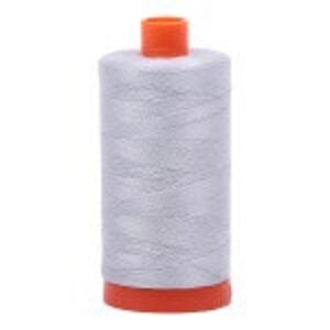 May include: A spool of light gray thread with an orange plastic top and bottom.