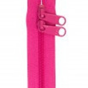 May include: A bright pink zipper with two metal sliders. The zipper is closed and has a smooth finish.