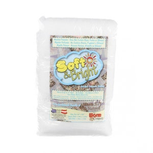 May include: A white bag of Soft & Bright Needled Polyester Batting. The bag is made in the USA and is 45" x 60". The bag has a label that says "Warm & Natural" and "The Warm Company".