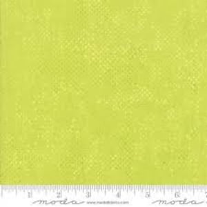 May include: A solid green fabric with a subtle, textured pattern. The fabric has a slightly rough, almost grainy texture.