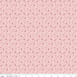 May include: A pink fabric with a repeating pattern of small white flowers and red leaves.