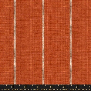May include: Orange fabric with white vertical stripes. The fabric has a textured woven look.