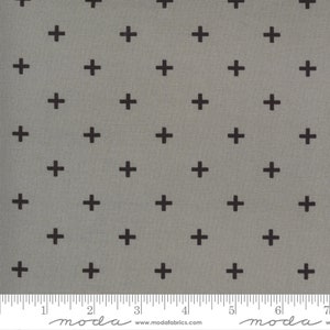 May include: A gray fabric with a repeating pattern of black plus signs. The fabric is measured in inches.