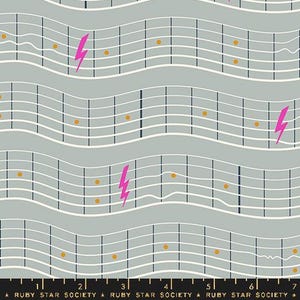 May include: A gray and white fabric with a repeating pattern of wavy lines, musical notes, and pink lightning bolts. The fabric has a gold ruler with the numbers 1 through 7 printed on it. The text "RUBY STAR SOCIETY" is printed on the ruler.