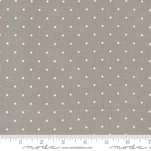 May include: A close-up of a gray fabric with a white polka dot pattern. The fabric is textured and has a subtle sheen. The polka dots are evenly spaced and are about 1/4 inch in diameter.