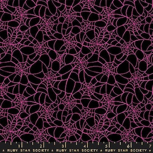 May include: Black fabric with a repeating pattern of pink spiderwebs. The webs are detailed and cover the entire surface. The design is suitable for Halloween or gothic-themed projects.