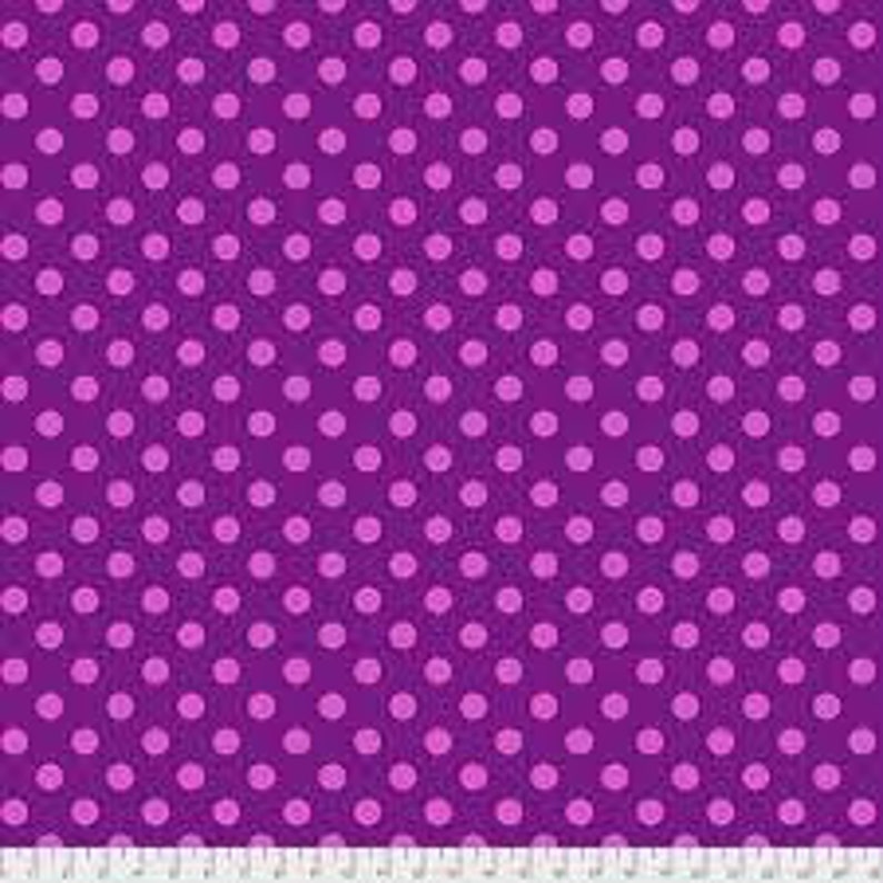 May include: Purple fabric with a white polka dot pattern.