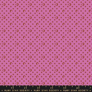 May include: A pink fabric with a repeating pattern of small red stars and crescent moons.