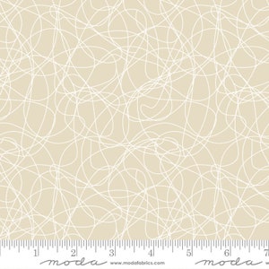May include: Beige fabric with a white abstract pattern of overlapping lines and curves. The fabric is marked with a ruler in inches and the words "moda" and "www.modafabrics.com".