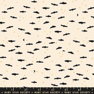 May include: Cream-colored fabric patterned with black bats, gold stars, and crescent moons. The bats are in various poses, scattered across the surface. The text "RUBY STAR SOCIETY" is printed at the bottom.