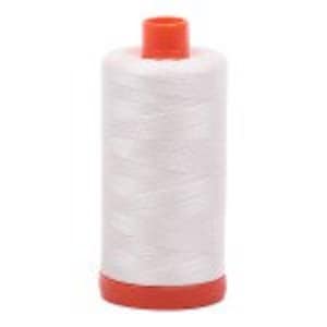 May include: A spool of white sewing thread with an orange top and base. The thread is tightly wound, and the spool is cylindrical. The orange base and top provide a contrasting color to the white thread.