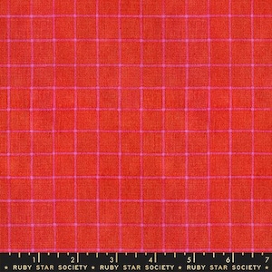 May include: Close-up of a fabric with a grid pattern. The fabric is a vibrant red-orange color, with a grid overlay in a bright pink hue. The fabric has a textured appearance. The text "RUBY STAR SOCIETY" is at the bottom.