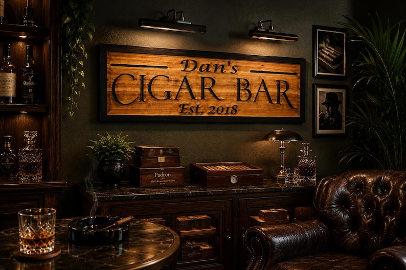 May include: A dimly lit cigar bar with a wooden sign that reads "Dan's Cigar Bar Est. 2018". The room features a leather armchair, a table with a cigar and ashtray, and a cabinet with cigar boxes.