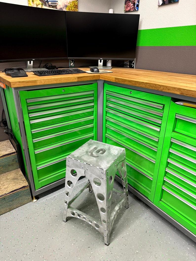 bomber style shop stool in place in front of toolbox