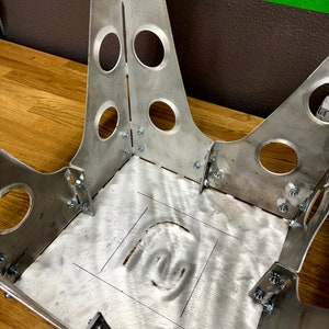 Bolt together assembly makes bomber shop stool easy to assemble with basic tools.