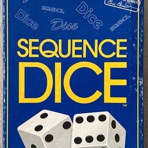 May include: A blue box with the words "SEQUENCE DICE" in yellow letters. The box has a picture of two white dice with black dots on them. The box also has the words "FROM THE MAKERS OF THE SEQUENCE GAME" in a blue box in the top left corner.