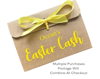 May include: A brown paper envelope with the text "Ocean's Easter Cash" in yellow script. A yellow ribbon is tied in a bow at the top. The envelope is sealed with a small hole and a knot.