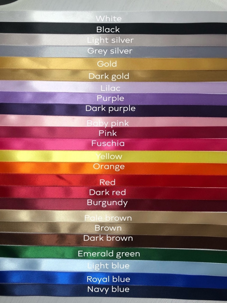 May include: A collection of colorful ribbons in various shades, including white, black, gold, purple, pink, red, and blue. Each ribbon is labeled with its color name in white text. The ribbons are arranged horizontally, showcasing a wide range of hues.