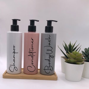 White,Pink & Grey Tubular Bottles With Matte Black Pumps | 250ml Refillable Reusable Plastic Bottle | Any Word | Bamboo Tray Set Of 3