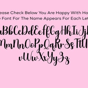 May include: A pink background displays a black, cursive font alphabet, from A to Z, in both uppercase and lowercase. The text at the top reads, "Please Check Below You Are Happy With How The Font For The Name Appears For Each Letter."