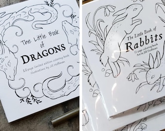 May include: Two coloring books, one with a dragon design and the text "The Little Book of Dragons" and the other with a rabbit design and the text "The Little Book of Rabbits". Both books are 12-page limited edition coloring books with illustrations by Jill Hoffman.