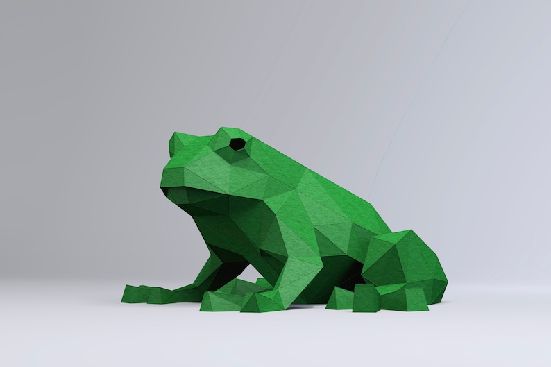 May include: A green origami frog sculpture. The frog is made of paper and has a geometric design.