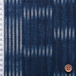 May include: Indigo blue fabric with a white stripe pattern. The fabric has a textured, woven look.