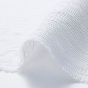 May include: White ribbed fabric with a raw edge. The fabric is folded over and the ribbing is visible.