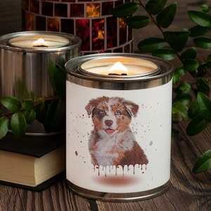 May include: Two silver candle jars with a white label. The label on the front jar features a watercolor illustration of a brown and white Australian Shepherd puppy. The text "Shhh... I'm napping" is printed on the label.