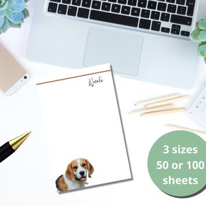 May include: Personalized notepad with a brown line and the name "Nicole" at the top. The notepad features a beagle dog image and is available in 3 sizes with 50 or 100 sheets.