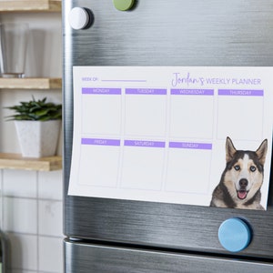 May include: A weekly planner with a purple border and the text "Jordan's Weekly Planner" at the top. The planner is divided into seven days of the week: Monday, Tuesday, Wednesday, Thursday, Friday, Saturday, and Sunday. A photo of a husky dog is in the bottom right corner.