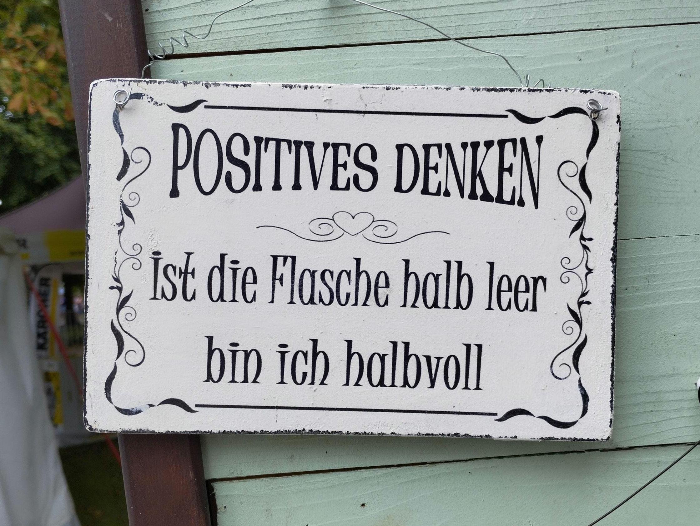 Positive thinking, the bottle is half empty, shabby sign, toast