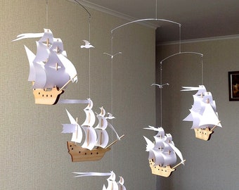 Five beautiful wooden sailboats with snow-white sails. Beautiful decor for any room in the house. Children&#39;s mobile.