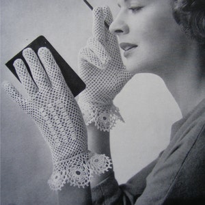 May include: A pair of white crocheted gloves with a delicate lace trim. The gloves are shown being worn by a woman who is applying makeup.