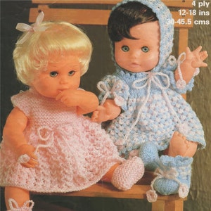 May include: Two knitted doll outfits, one pink and one blue, with matching booties. The outfits are made with 4 ply yarn and are sized for 12-18 inches (30-45.5 cm) dolls.