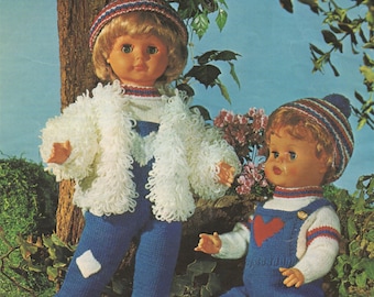 May include: Two knitted doll outfits in blue and white. The girl doll outfit includes a white fuzzy jacket, blue pants, and a striped hat. The boy doll outfit includes a blue overall with a red heart, a white sweater, and a striped hat.