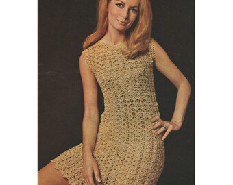 May include: A crochet dress with a sleeveless design and a round neckline. The dress is made of a light beige yarn and has a loose, flowing fit.